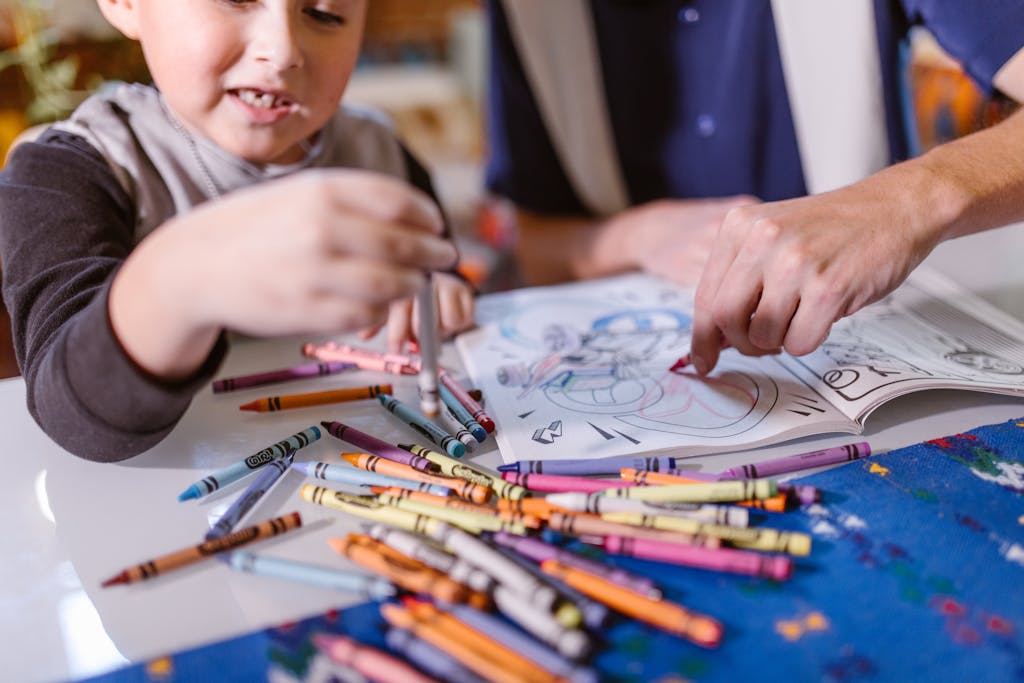 Boy in Gray Crew Neck Shirt Holding Paint Brush