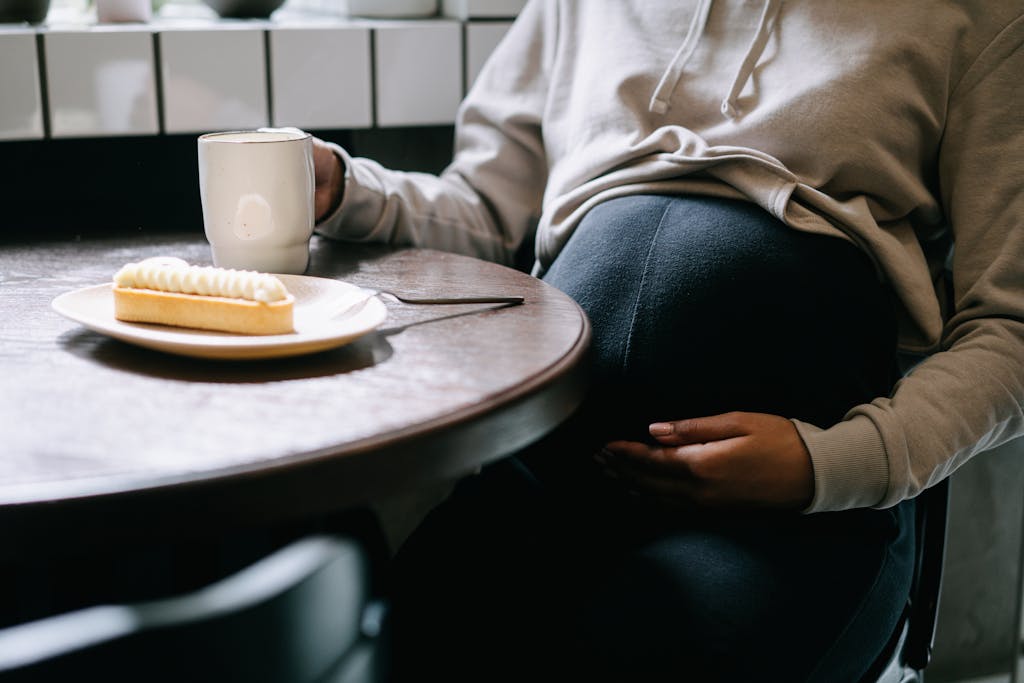 Pregnant Woman Eating and Drinking